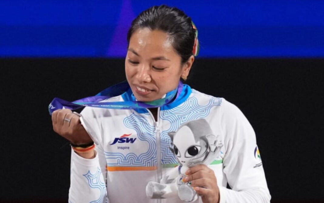 Mirabai Chanu celebrates after winning silver at Asian Games 2026