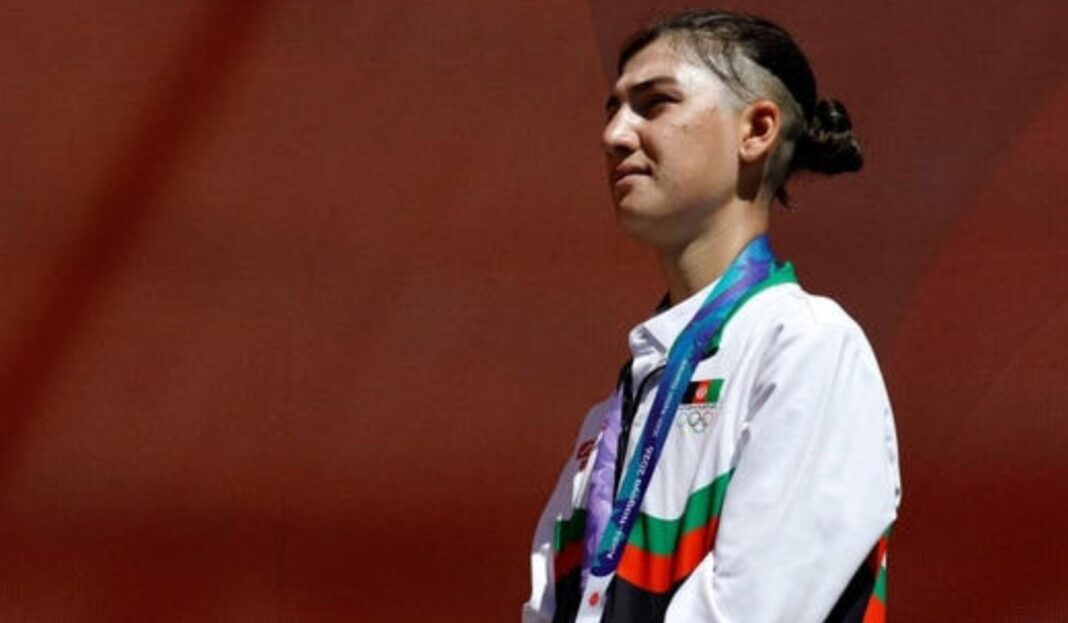 Fariba Hashimi celebrates after winning silver for Afghanistan at Asian Games 2026